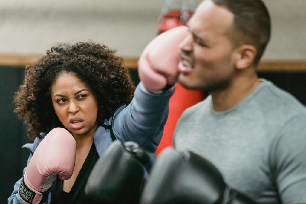 Black woman punching personal trainer in face